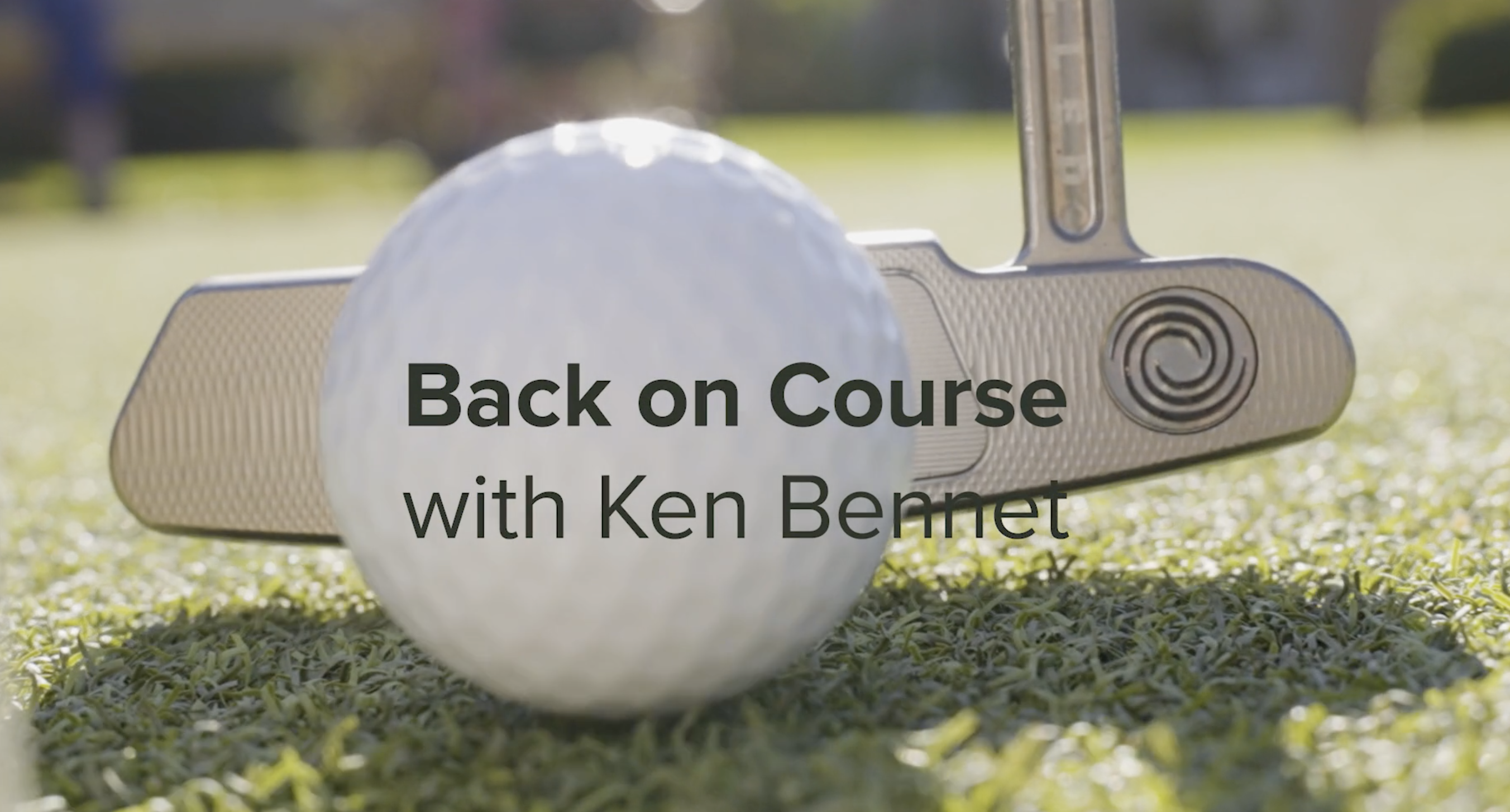 a golf ball is hit by a putter and a text overlay reads: Back on Course with Ken Bennet 